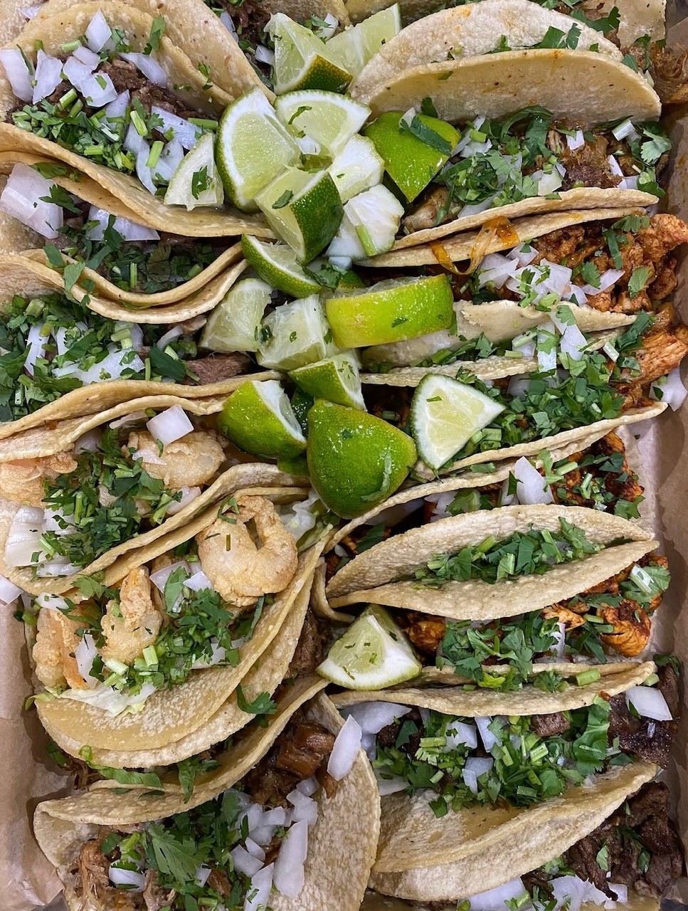 Street tacos with cilantro, onion, and lime from Taqueria La Ventana